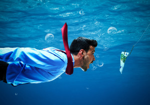 Underwater scene of a businessman taking the bait