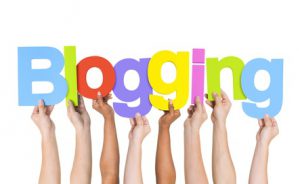Multi Ethnic People Holding The Word Blogging